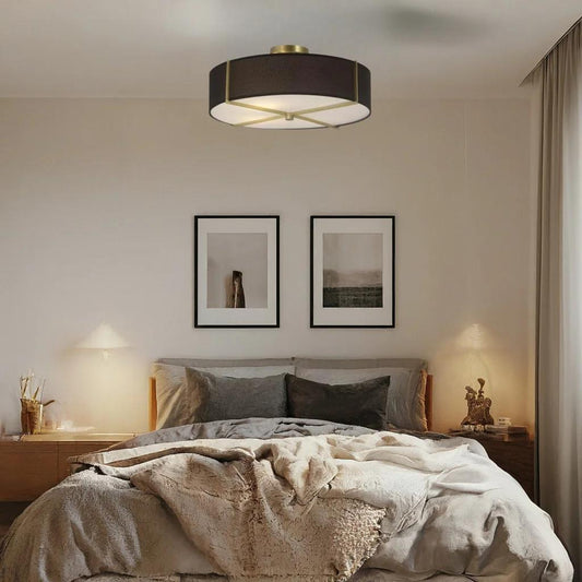 Black flush-mount ceiling light, by Maple, for hallway, bedroom, or entryway, angled view