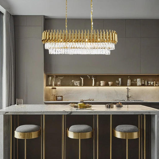 Gold metal + clear crysta chandelier, by Maple, angled view