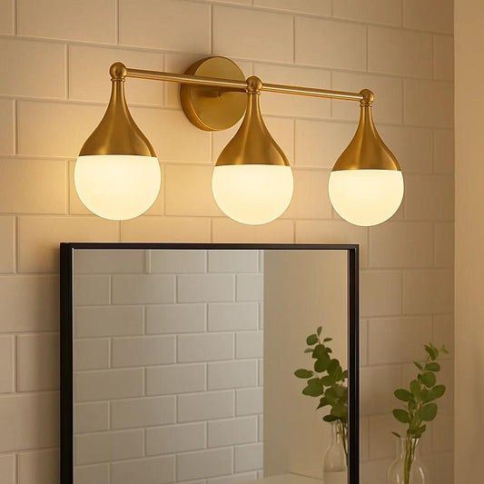 Gold finish vanity light, by Maple, for bathroom, angled view