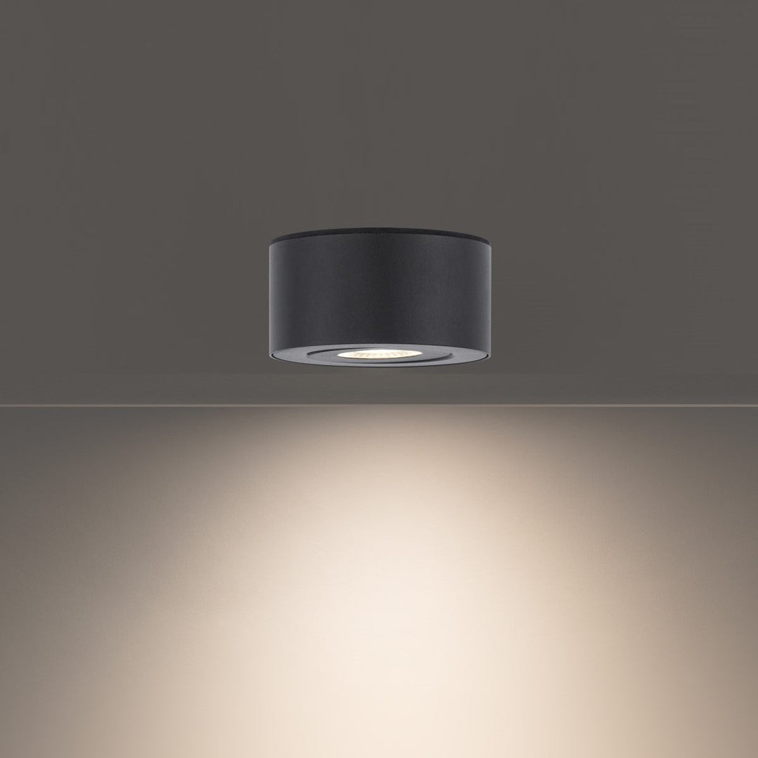 Sleek outdoor ceiling light with black finish and LED technology for patios.