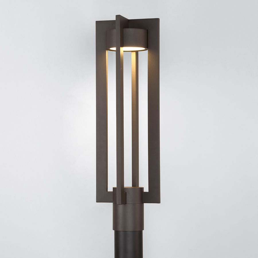 Tall outdoor post light with elegant design for large entrances.