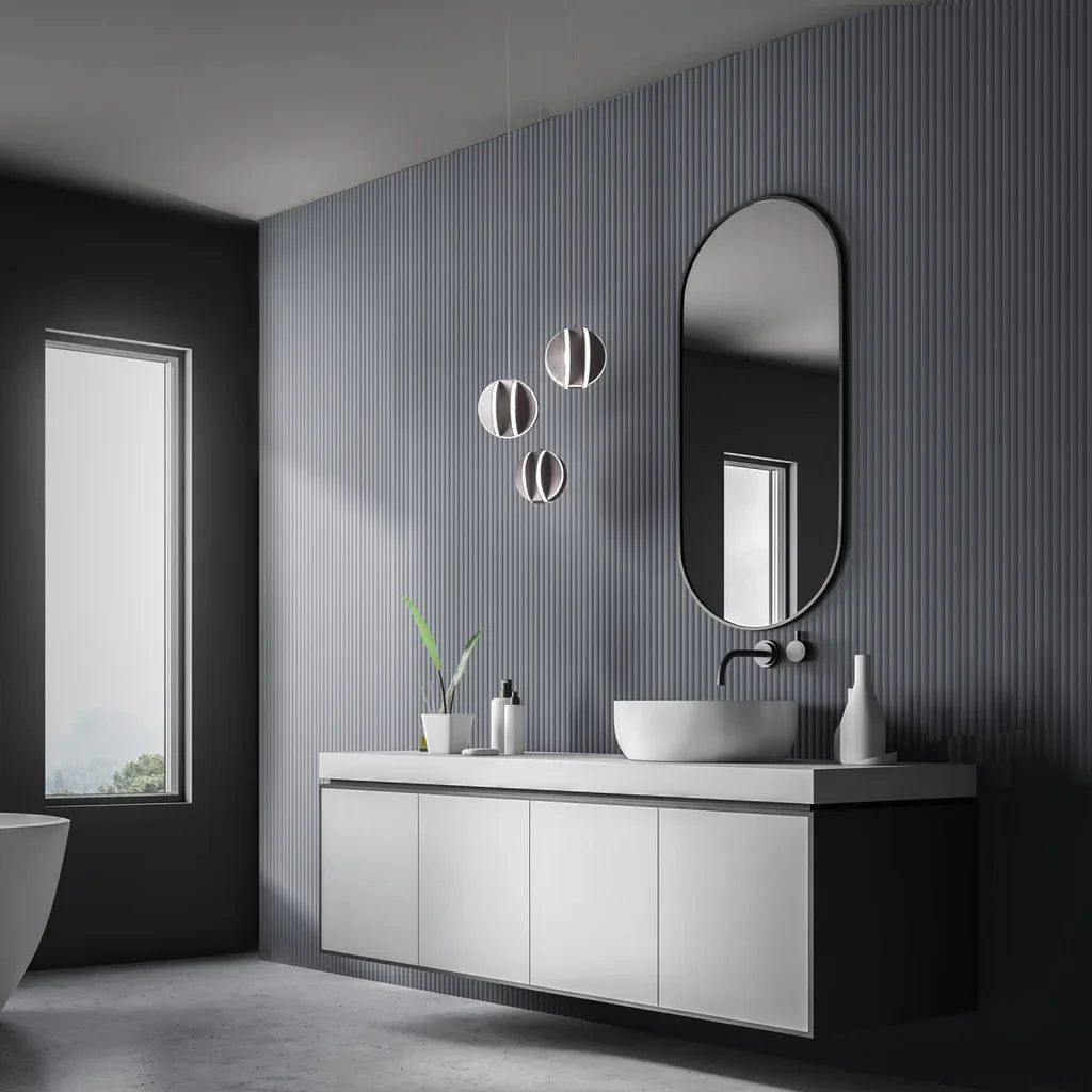 Modern bathroom lighting featuring sleek pendant lights, a floating vanity, and a dark textured accent wall.