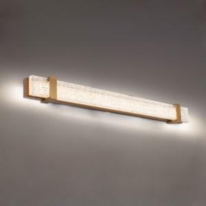 Aged brass vanity light, by Schonbek, for bathroom