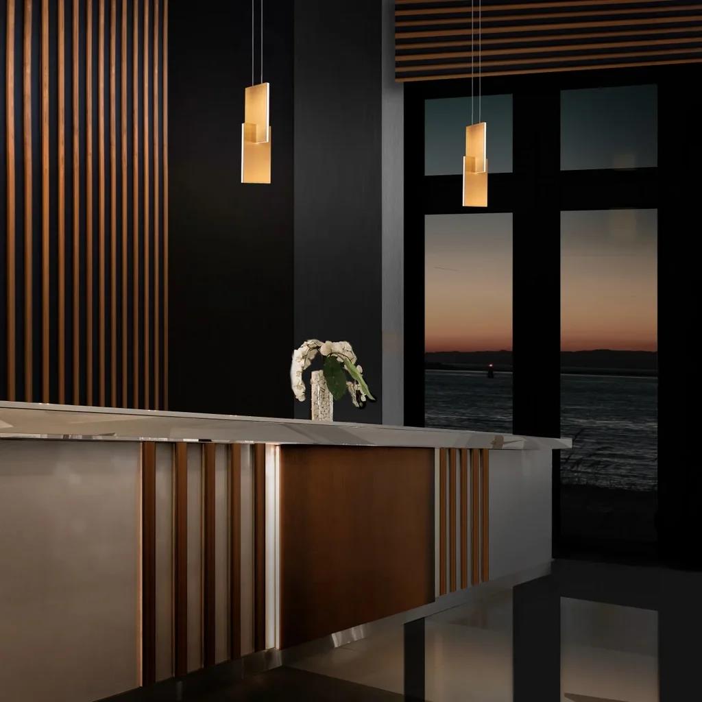 Aged brass finish chandelier, by Modern Forms, angled view