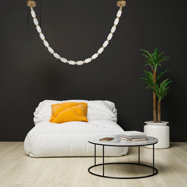 Aged brass finish chandelier, by Modern Forms, angled view