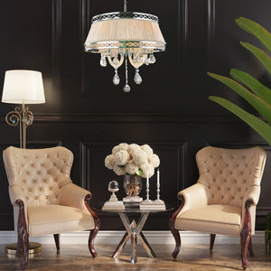 Chrome metal + clear crystal+champagne gold shade chandelier, by Maple, angled view