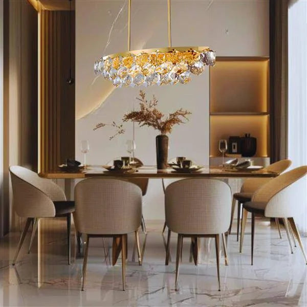 Gold finish + clear crystal island pendant, by Maple, for kitchen island or dining, angled view