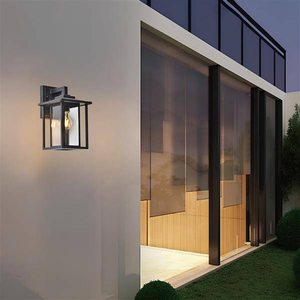 Sanded black wall sconce, by Maple, for hallway or living room, angled view